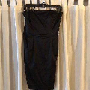 Black strapless above knee cocktail dress.